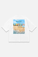 Along The Shore white oversized organic cotton T-shirt, back view – Studio Drop