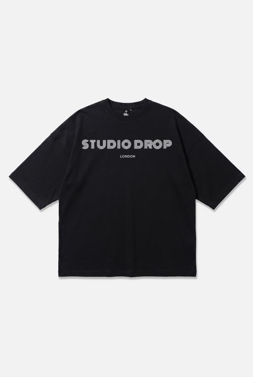 Momentum Logo Tee black oversized organic cotton T-shirt, front view – Studio Drop