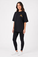 Model wearing Whimsy Tee in black, front view – Studio Drop UK streetwear