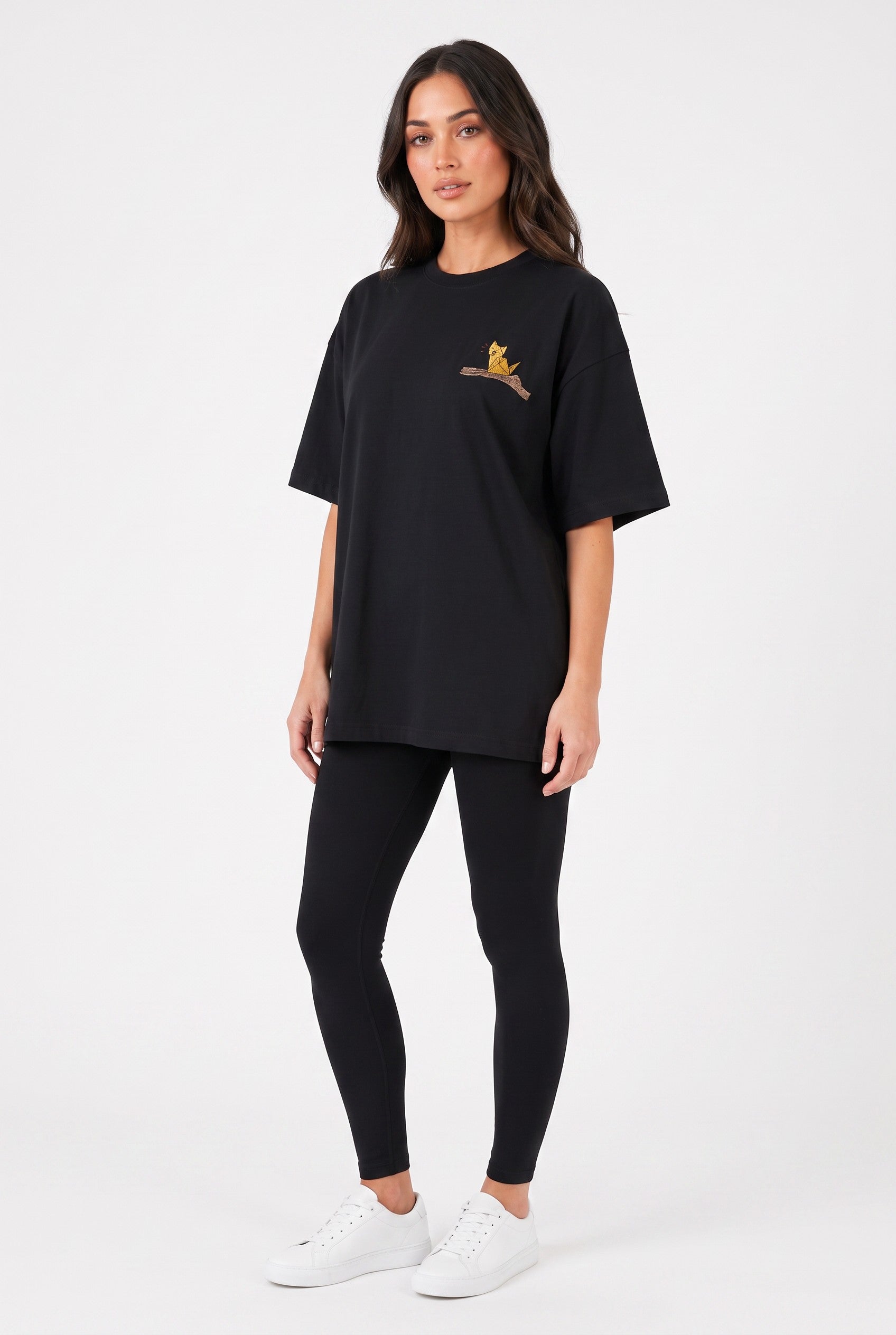 Model wearing Whimsy Tee in black, front view – Studio Drop UK streetwear