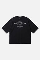 Moment Tee black oversized organic cotton T-shirt, front view – Studio Drop
