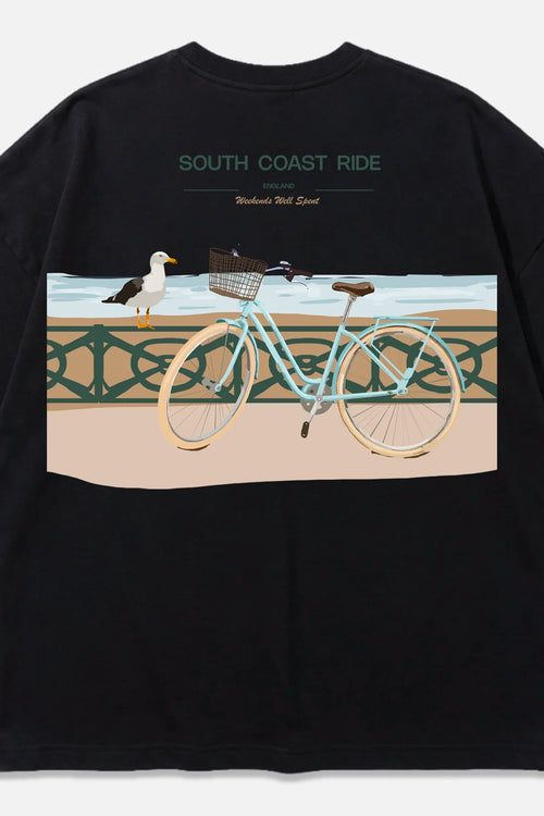 South Coast Ride black oversized organic cotton T-shirt, back view – Studio Drop