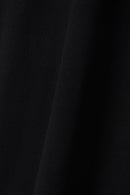Close-up of black GOTS-certified organic cotton T-shirt fabric texture – Studio Drop