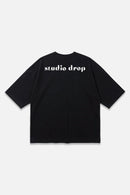 Archive Tee black oversized organic cotton T-shirt, back view – Studio Drop